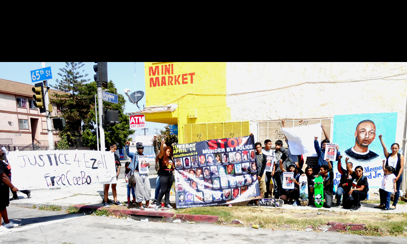 Los Angeles: High School students and Revolution Club members  at site of police murder of Ezell Ford. Photo: special to revcom.us